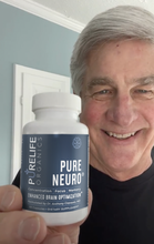 Load image into Gallery viewer, Senior happily holding Pure Neuro from PureLife Organics
